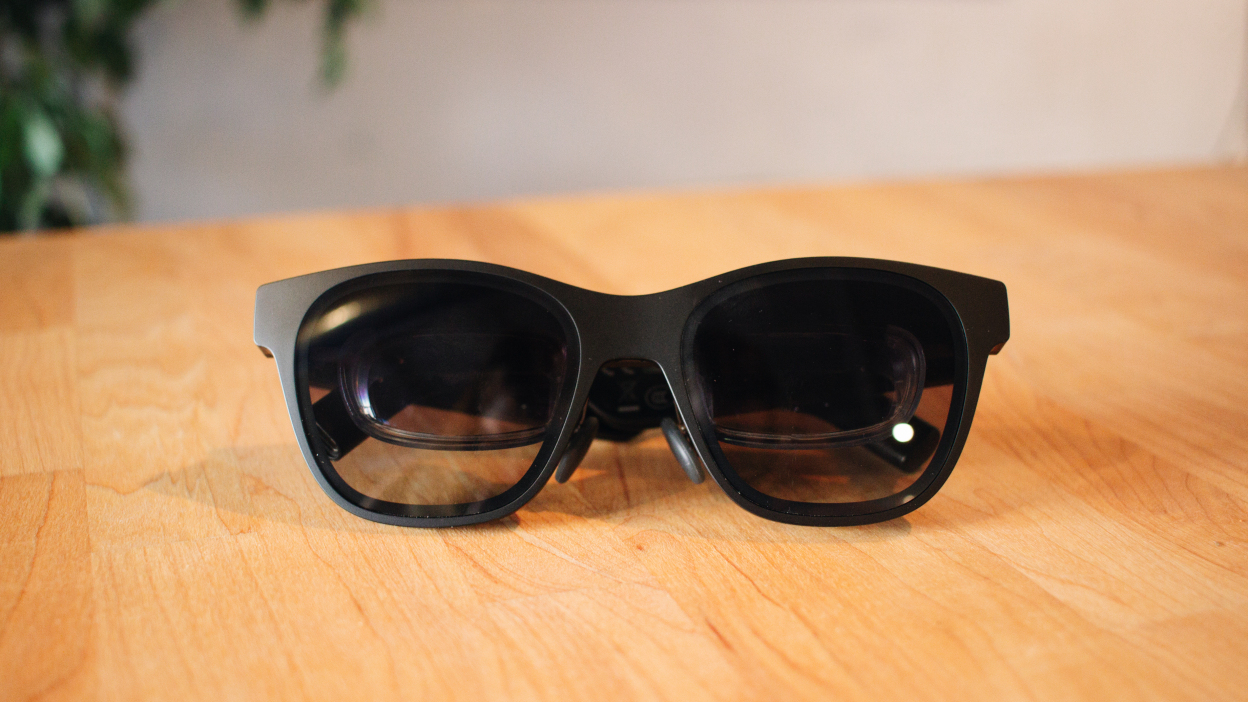 pair of tinted AR glasses with smaller lenses inside