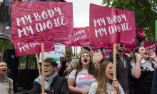 Pro-choice supporters stage a demonstration in Parliament Square to campaign for women's reproductive rights, legalisation of abortion in Northern Ireland and its decriminalisation in the UK on 11 May, 2019 in London, England.