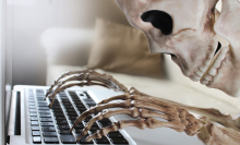 Skeleton at computer