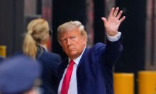 Donald Trump waving at trump tower