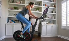 Woman riding an Echelon Smart Connect Bike