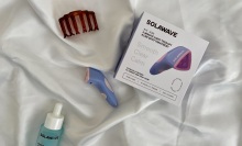 solawave bye acne wand with box and solawave serum next to a hair clip