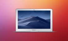 MacBook Air on red background