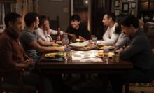 A family of seven eating dinner.