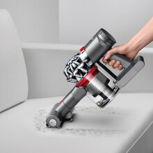 Dyson V7 Trigger Cord-Free Handheld Vacuum on stairs.