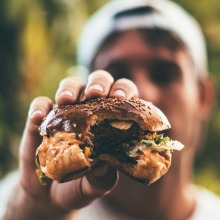 man holding burger