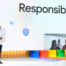 A Google executive standing in front of a slide that says 'responsible AI'
