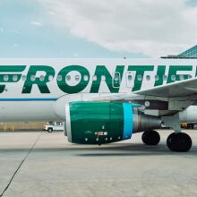 Frontier Airlines plane on ground at airport