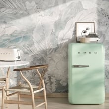 Smeg FAB10 fridge in a kitchen next to a Smeg toaster, kitchen table, lamp, and more items.