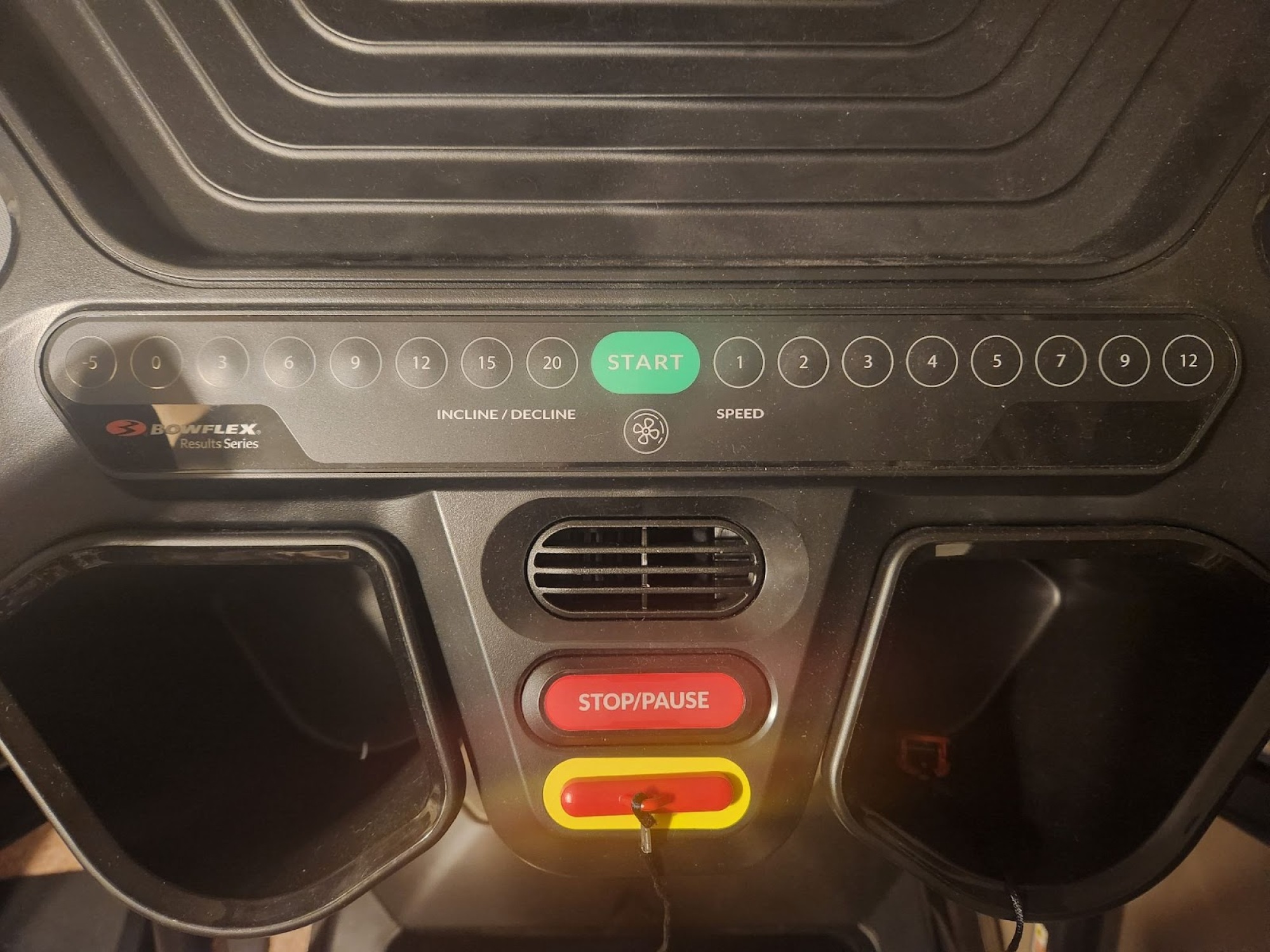 treadmill control panel with speed and incline buttons