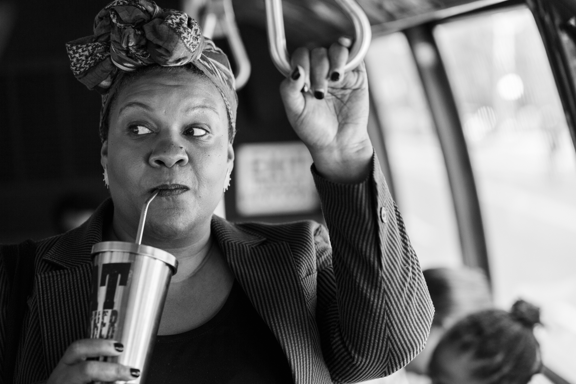 Radha Blank sips tea on a bus in "The Forty-Year-Old Version." 