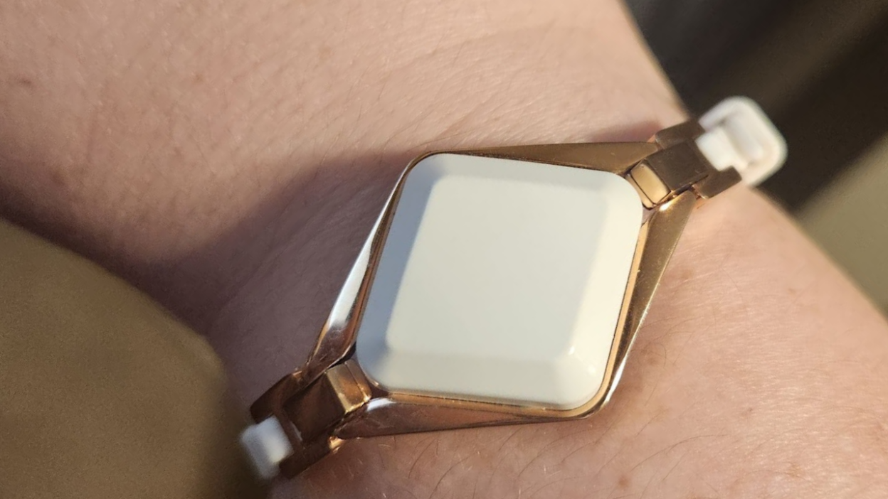 white diamond shaped screenless fitness tracker bracelet