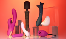pink and black sex toys in front of an orange backdrop
