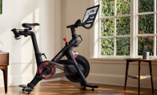 Peloton bike in bright and airy living room