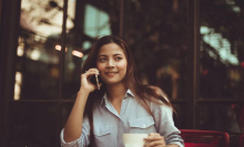 woman talking on phone in coffee shop