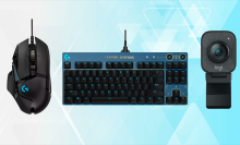 Logitech keyboard, mouse, and webcam on blue background