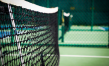 Grass tennis court with close up of net