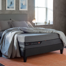 Layla Hybrid Mattress on bed frame with sheets and pillows