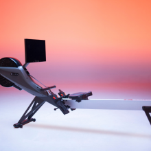 rowing machine against colorful background