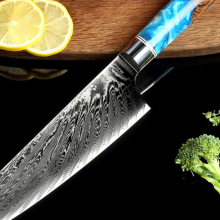 kiru knife chef knife on counter next to broccoli and lemons