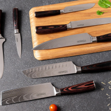 set of seido knives and cutting board laying on counter