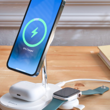 wireless charging station on desk charging iphone, apple watch, and airpods