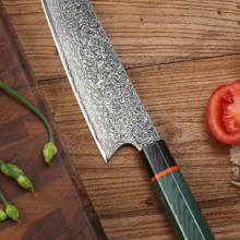 kiru all-around knife laying on counter with vegetables